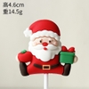 Tượng nhựa dẻo-ông già noel  cầm hộp quà màu xanh đỏ.