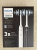 Set 2 chiếc bàn chải điện Philips Sonicare 2300 (Đen/Trắng)
