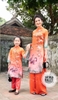 Bộ áo dài cam đôi vịt cườm
