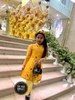 Bộ áo dài voan thêu hoa vàng