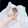Đồng Hồ Nữ Hanboro Mặt Ovan Xoáy Kim Loại Vàng Hồng Đính Full Đá Dây Cao Su Trắng Size 36mm