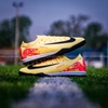 Giày Bóng Đá Nike Mercurial Vapor 16 Pro Mbappe Vàng Cam Vạch Đen Cổ Lửng TF