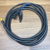 Cuộn cáp MC4 to XT60 Solar Cable đặt trên mặt bàn gỗ