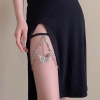 Butterfly necklace worn on thigh