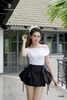 Quần váy tùng phồng đính nơ túi