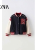 Áo khoác nỉ bomber Zara thêu chữ R tông xanh đỏ phối tay da trắng