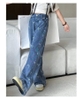 Quần jean ống loe dài họa tiết nơ size đại