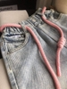 Quần baggy jean cạp chun phối dây hồng mặt cười cho bé gái