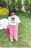 Bộ Kuromi Sofia Candy áo cộc tay trắng quần thô dài caro hồng