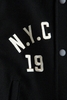 Áo khoác bomber N.Y.C CLUB 1973 H&M màu đen phối tay da trắng