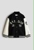 Áo khoác bomber N.Y.C CLUB 1973 H&M màu đen phối tay da trắng