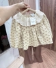 Bộ áo babydoll tăm hoa nhí vàng và quần nâu loe