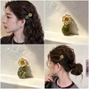 Set 3 kẹp tóc hoa vàng mix đá xanh
