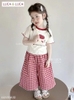 Bộ Hello Kitty Luca&Luca áo trắng viền đỏ mix quần caro suông dáng lửng