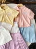 Bộ polo cộc tay New Balance màu pastel mix chân váy xếp ly 3 màu
