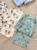 Bộ Pyjama Qibao trắng hình bé gái tóc nâu nơ đỏ