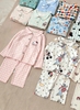 Bộ Pyjama Qibao trắng hình bé gái tóc nâu nơ đỏ