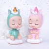 Tuong - Em bé sừng ngồi mây hồng