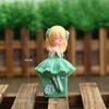 Tuong - bé gái ngồi ngủ ôm ngực xanh lá