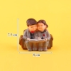 Cặp tượng ông bà đọc sách