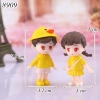 Tượng cặp đôi áo vàng TQ