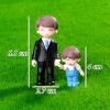 Tượng bố áo đen và con trai áo xanh TQ
