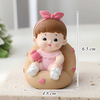 Tượng Sứ Bé Gái Hồng Ngồi Đệm Tim Cầm Kẹo TQ