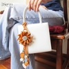 Charm hoa dã quỳ iSeren, da dê cao cấp, da thật handmade, móc khóa, charm treo túi xách, quà tặng cao cấp